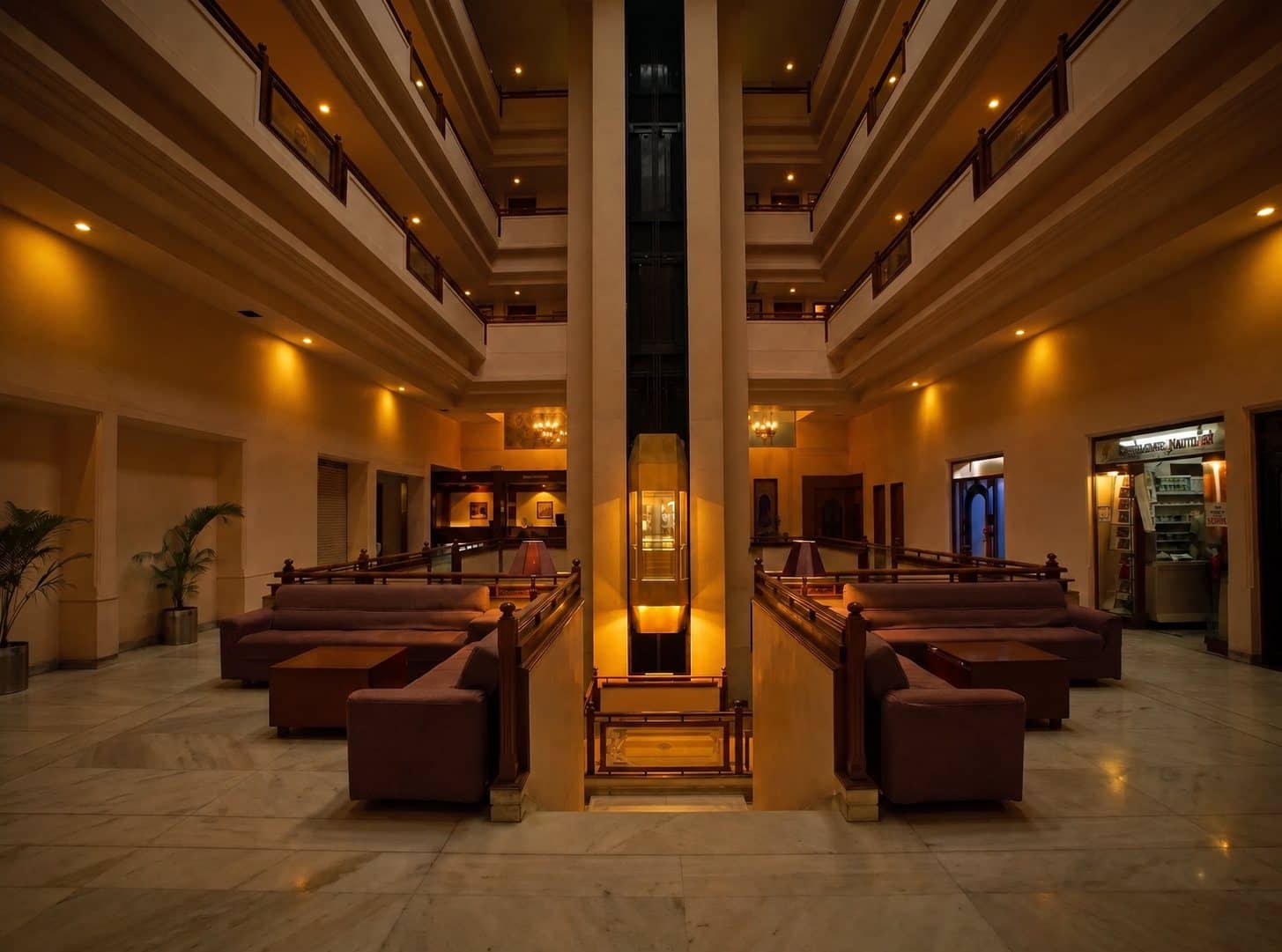 Atrium lobby with the brass lift at Hotel Sai Prakash, Nampally, Hyderabad