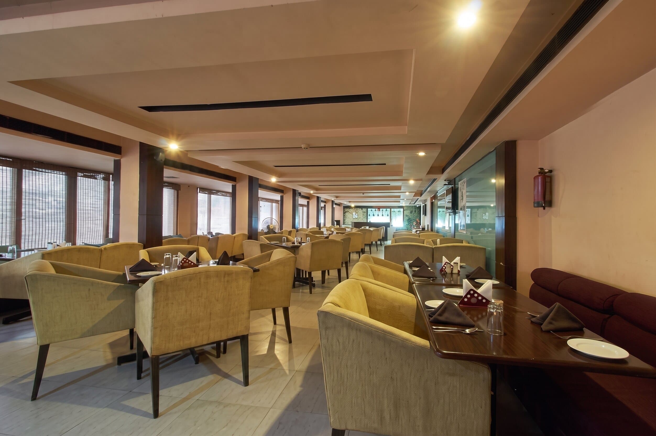 Multi-cuisine restaurant seating at Hotel Sai Prakash